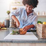 young-african-woman-working-at-juice-bar-PKGB4SA.jpg